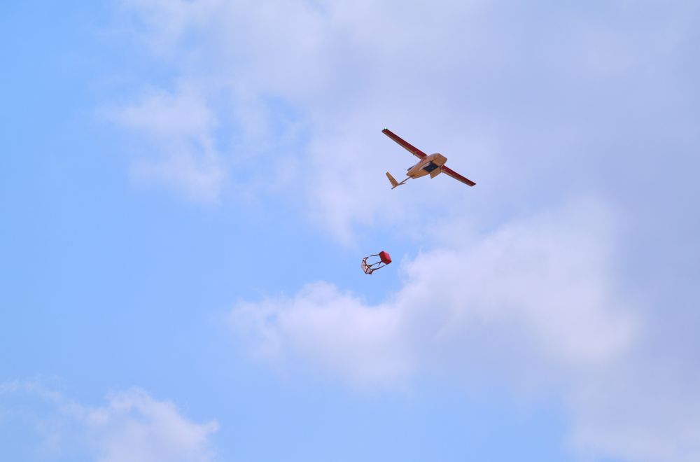 Plane dropping COVID-19 vaccines from zipline drone in Ghana